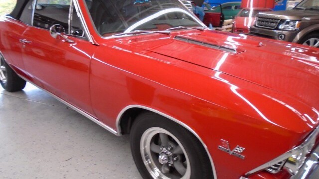Red classic Chevy convertible.