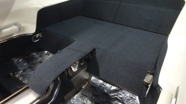 Classic car's rear interior carpet.