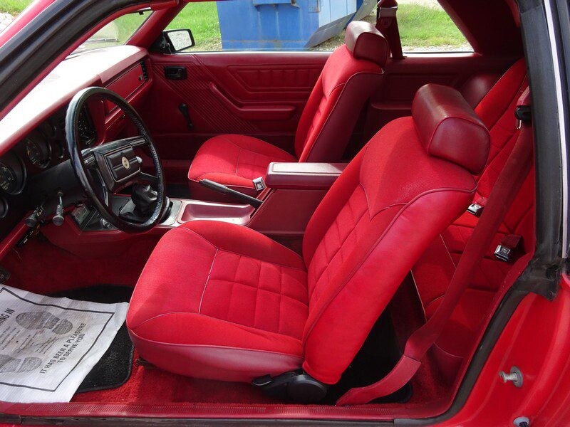 Red interior of a classic Mustang.