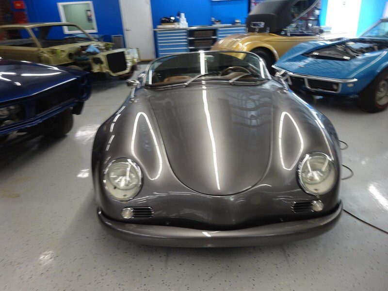 Gray Porsche 356 in auto shop.