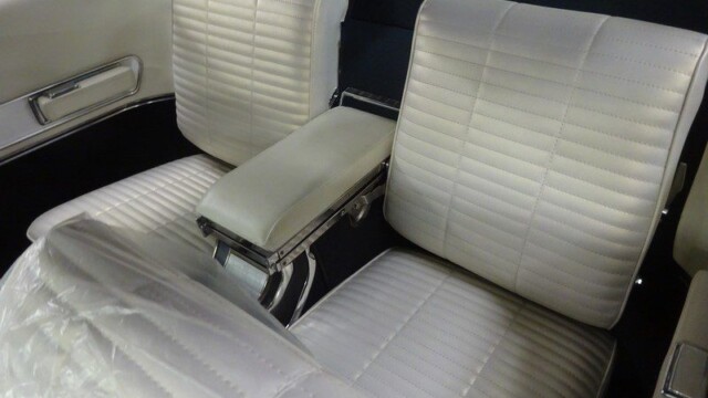 Classic car's white leather seats.