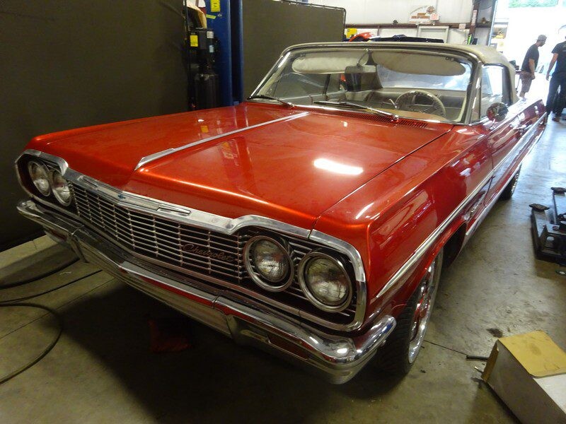 Red 1964 Chevrolet Impala convertible.