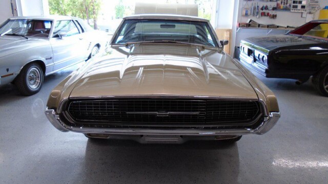 Beige Ford Torino in a garage.