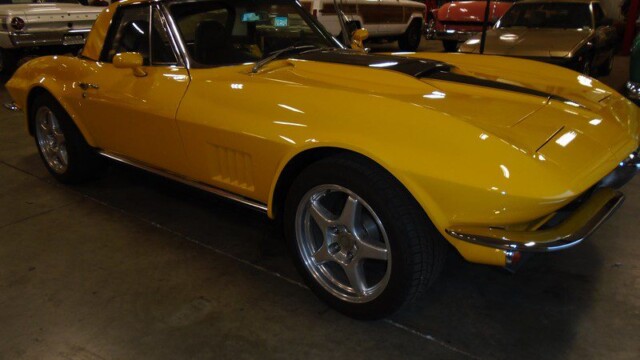 Yellow Corvette convertible classic car.