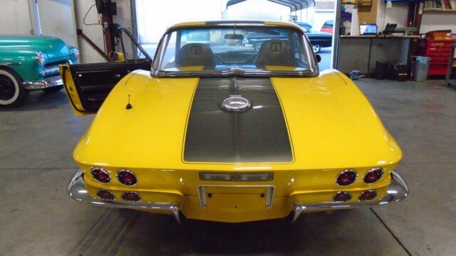 Yellow Corvette Stingray rear view.