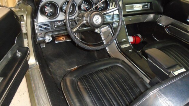 Classic car interior, black leather seats.