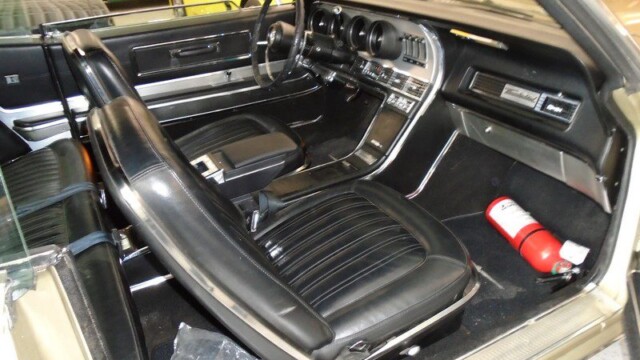 Classic car interior, black leather seats.