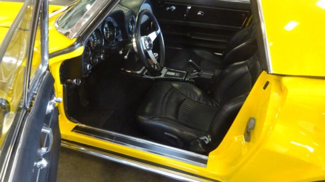 Yellow Corvette interior and driver's seat.