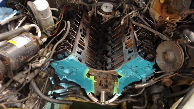 Painted teal engine block in car.