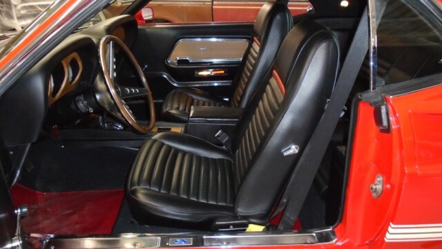 Red Ford Mustang interior, driver's seat.