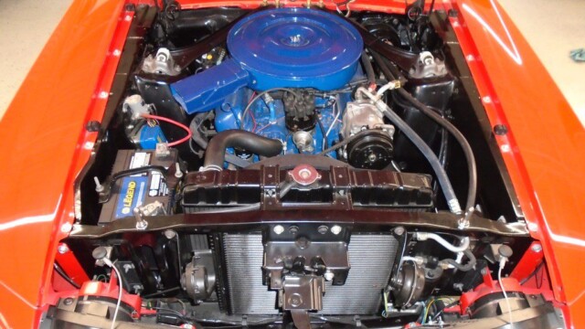 Red classic Mustang engine bay.