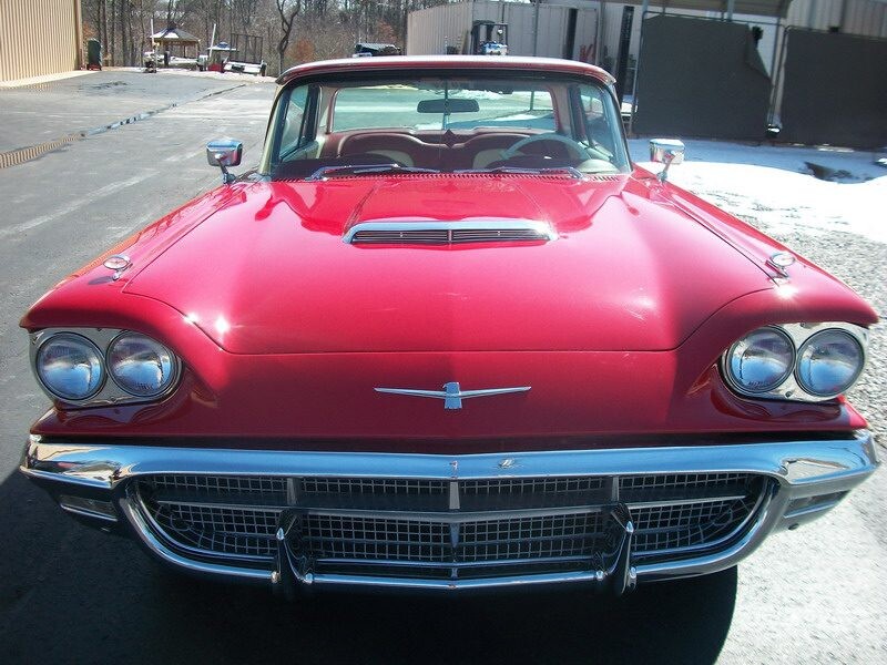 Red classic Ford Thunderbird car.