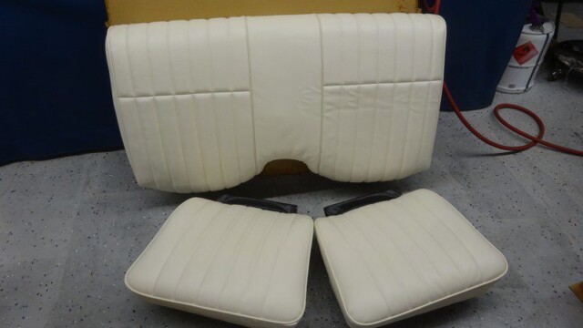 Off-white car seat upholstery set.