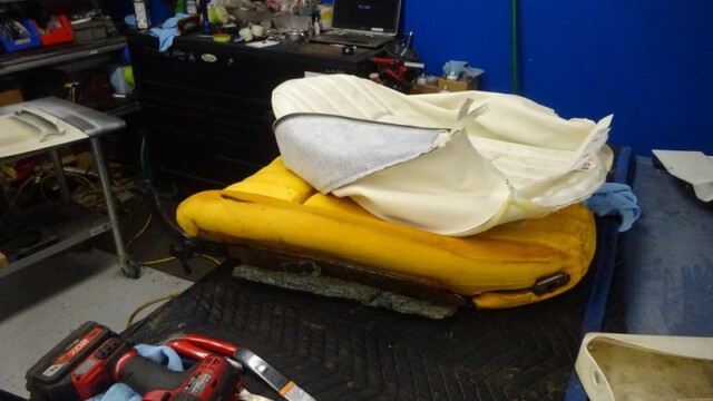 Car seat upholstery repair in progress.