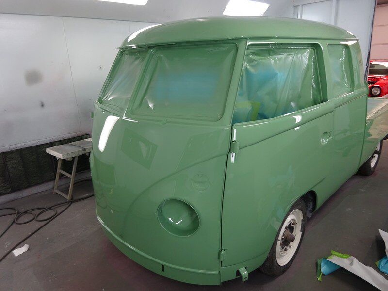 Freshly painted green Volkswagen pickup truck.