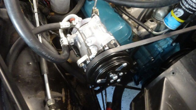 Car engine with new AC compressor.