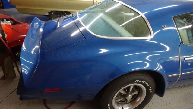 Blue Pontiac Trans Am rear quarter panel.