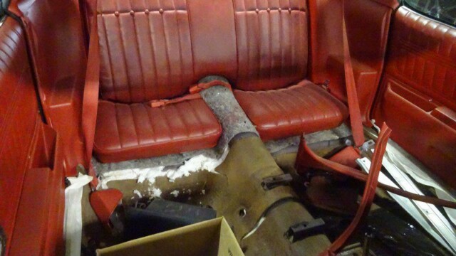 Red Camaro interior, stripped for restoration.
