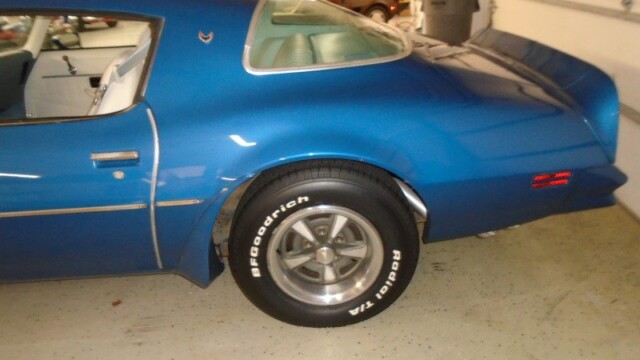 Blue Pontiac Firebird Trans Am rear view.