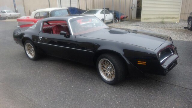 Black Pontiac Trans Am muscle car.