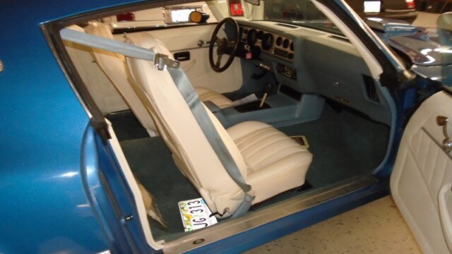 Blue Pontiac Firebird interior view.