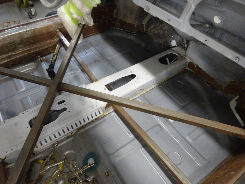Car floor restoration in progress.