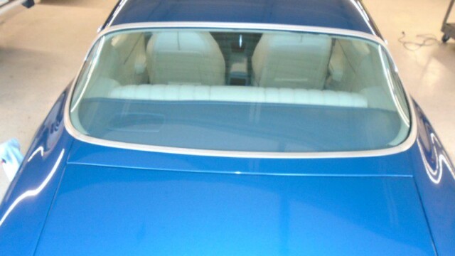 Blue Pontiac Firebird rear view.