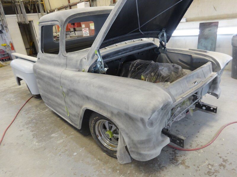 Grey primered classic Chevy truck body.