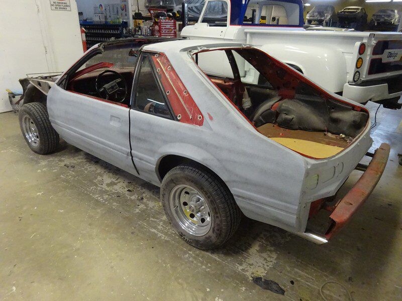 Red Ford Mustang restoration project.