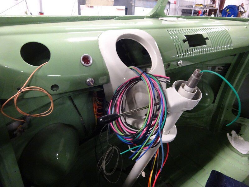 Vintage car dashboard wiring installation.