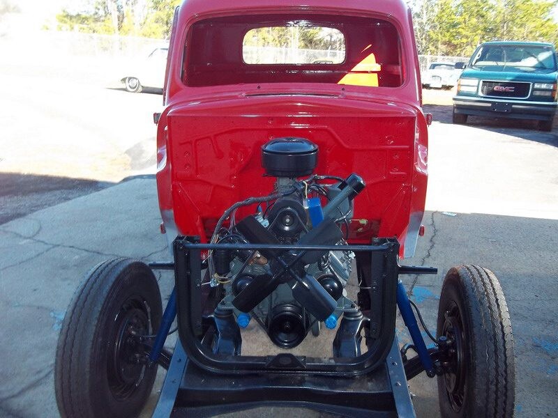 Red classic truck engine restoration.