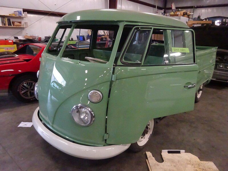 Green vintage Volkswagen pickup truck.