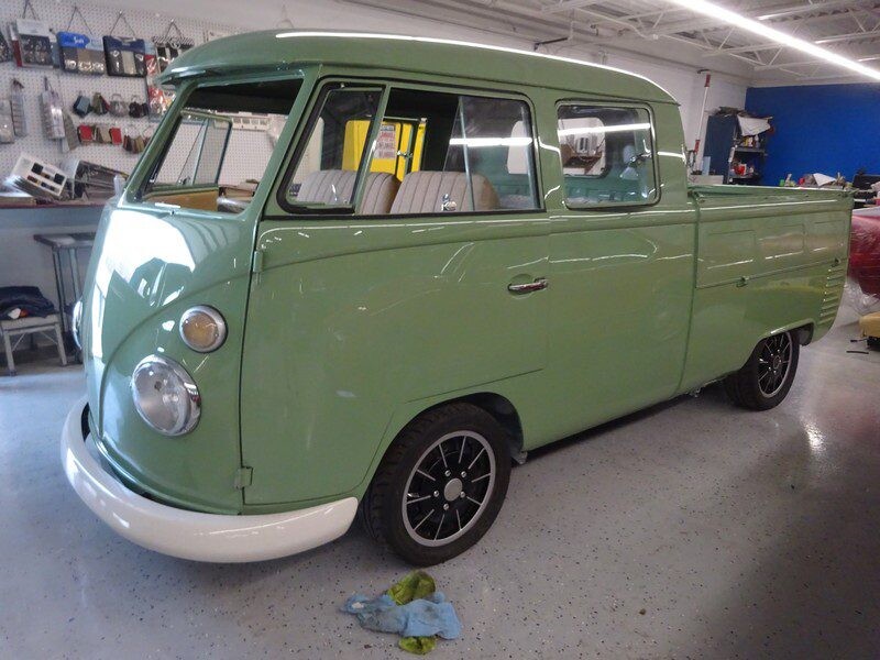 Vintage green Volkswagen pickup truck.