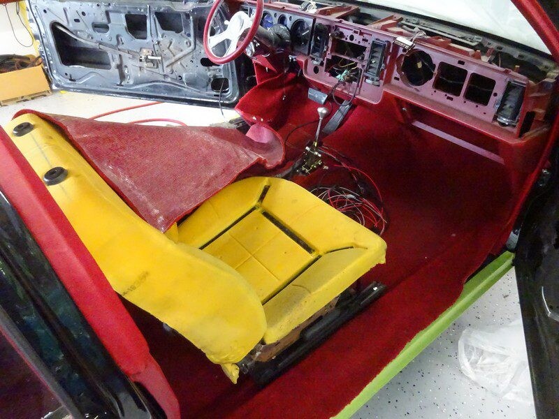 Custom car interior, red and yellow seats.