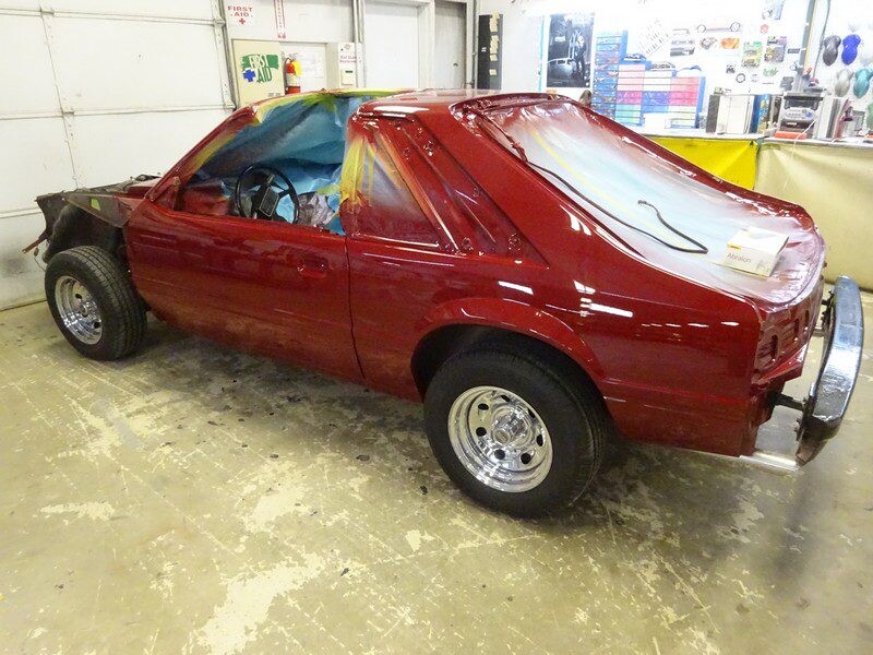 Red Ford Mustang restoration project.