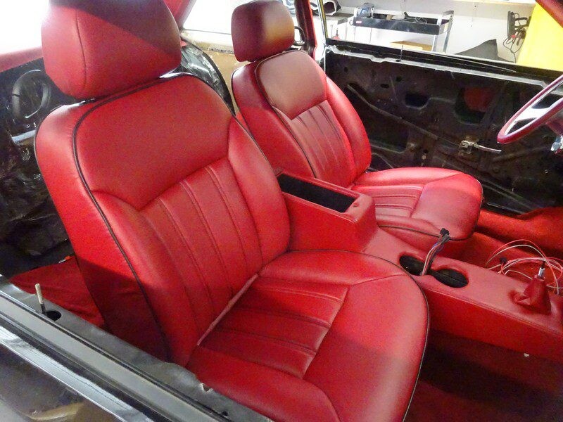 Red leather car interior seats.