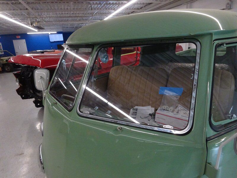 Green Volkswagen bus window detail.