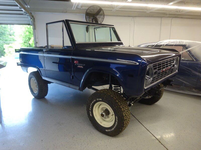 Restored classic Ford Bronco in blue.