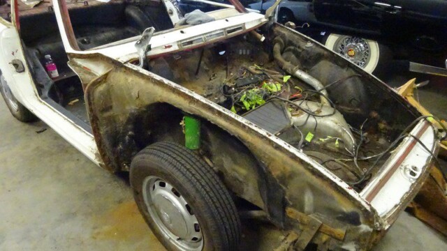Damaged classic car, restoration project.
