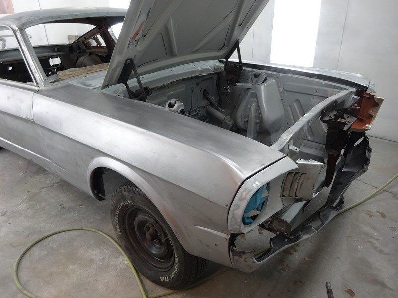 Silver Ford Mustang body restoration.