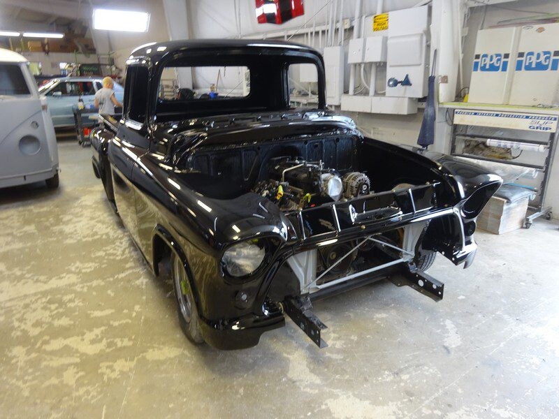 Black classic truck under restoration.
