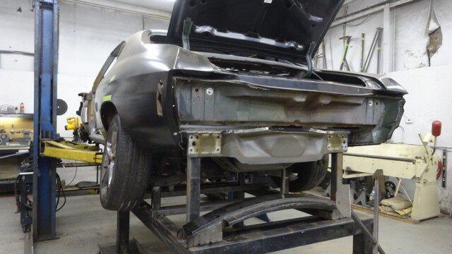 Classic car undergoing bodywork repair.
