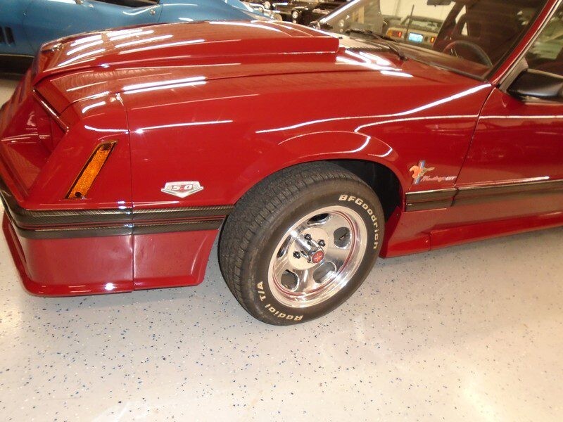 Red Ford Mustang 5.0 front view.