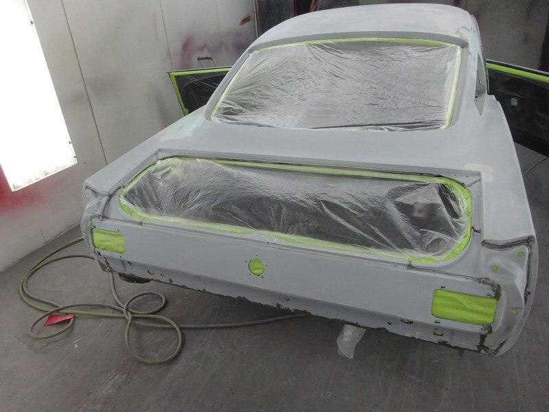 Primered classic car rear end.