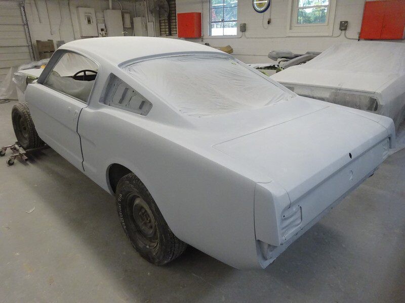 Primered Ford Mustang fastback restoration.