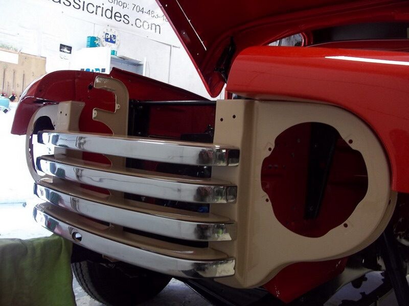 Red classic car bumper restoration.
