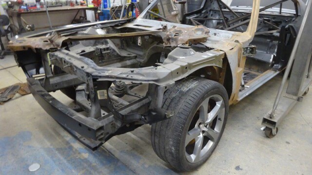 Classic car body restoration in progress.