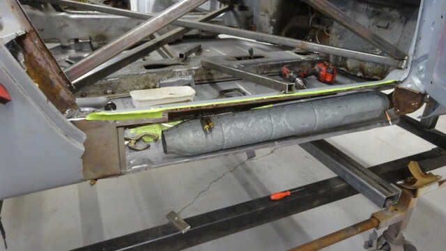 Car body restoration: floor panel repair.