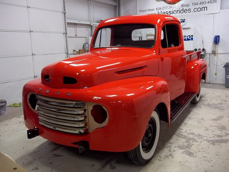 Restored red Ford pickup truck.