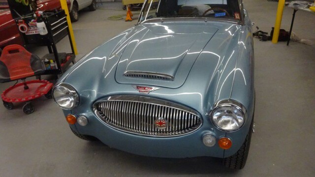 Light blue classic Austin Healey car.